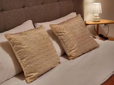 a bed with two pillows on top of it at Menelaou Cozy Apartment VIPGreece in Athens