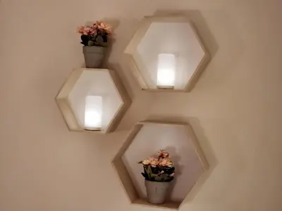 a wall with three lights and three vases with flowers at Menelaou Cozy Apartment VIPGreece in Athens