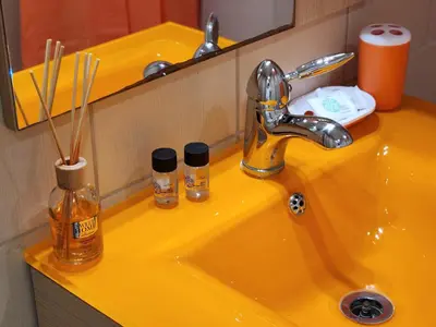 a yellow bathroom sink with a yellow sink at Menelaou Cozy Apartment VIPGreece in Athens