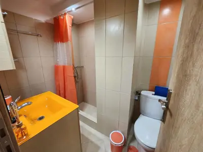 a bathroom with a toilet and a sink and a shower at Menelaou Cozy Apartment VIPGreece in Athens