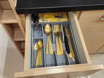 a drawer filled with utensils in a kitchen at Menelaou Cozy Apartment VIPGreece in Athens