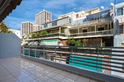 a balcony of a building with a swimming pool at Phaedrus Living Luxury Flat Ampelokipoi in Athens