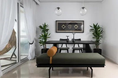 a dining room with a table and a green bench at Blue Chill Paradise Seaview Suite w/ Kingbed in Piraeus