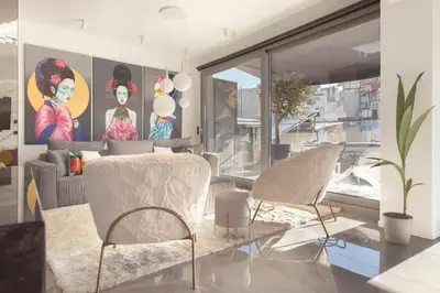 a living room with two chairs and a couch at Luxury Acropolis View Apartment-Living Stone Black Pearl in Athens