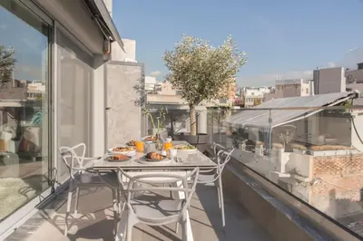 a table and chairs on a balcony with a view at Luxury Acropolis View Apartment-Living Stone Black Pearl in Athens