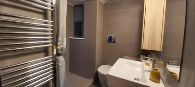 a small bathroom with a toilet and a sink at Thissio Central Onar in Athens