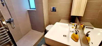 a bathroom with a sink and a shower and a toilet at Thissio Central Onar in Athens