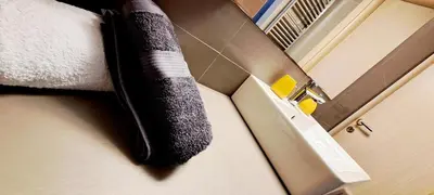 a towel hanging on a wall in a bathroom at Thissio Central Onar in Athens