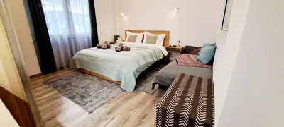 a bedroom with a large bed and a window at Thissio Central Onar in Athens