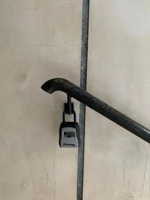 a wrench hanging on a wall in a garage at Marina Alkamenous apartment in Athens