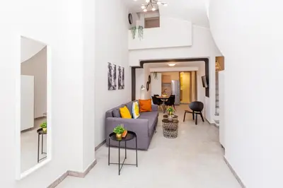 a living room with a couch and a table at Psirri Lofts in Athens