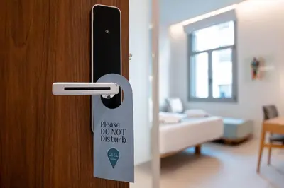 a door with a sticker on it with a room at Ciel Suites Athens in Athens