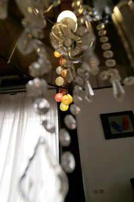 a row of wine glasses hanging from a wall at Aθens Dome - Apartments by Live&Travel in Athens