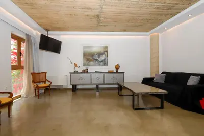 a living room with a couch and a table at Aθens Dome - Apartments by Live&Travel in Athens