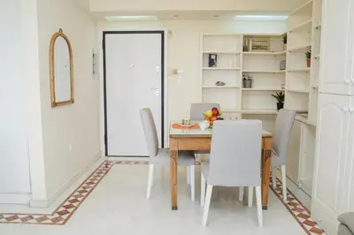 a dining room with a table and chairs at Endless Blue Studio in Glyfada in Athens