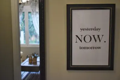 a framed picture on a wall next to a mirror at Vintage Apartment in Athens