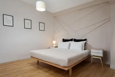 a bedroom with a white bed and a white ceiling at Comfort Suite by Acropolis Cozy Suites in Athens