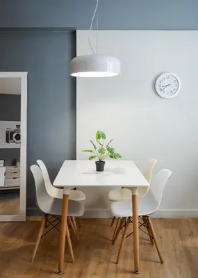 a dining room with a white table and chairs at Comfort Suite by Acropolis Cozy Suites in Athens