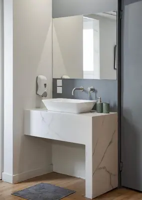 a bathroom with a white sink and a mirror at Comfort Suite by Acropolis Cozy Suites in Athens