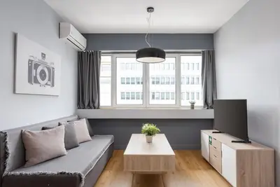 a living room with a couch and a tv at Classic Suite by Acropolis Cozy Suites in Athens