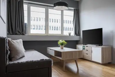 a living room with a tv and a couch at Standard Suite by Acropolis Cozy Suites in Athens