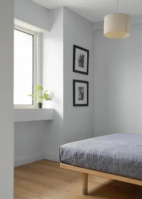 a white bedroom with a bed and a window at Standard Suite by Acropolis Cozy Suites in Athens
