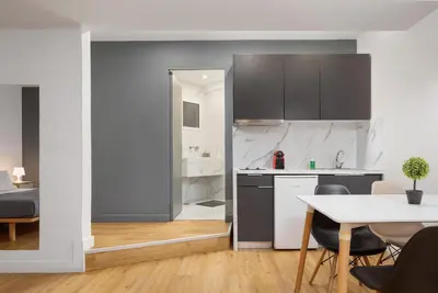 a kitchen and dining room with a table and chairs at Deluxe Suite by Acropolis Cozy Suites in Athens