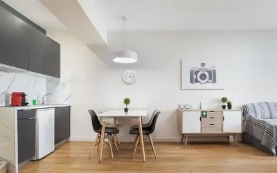 a kitchen and dining room with a table and chairs at Deluxe Suite by Acropolis Cozy Suites in Athens
