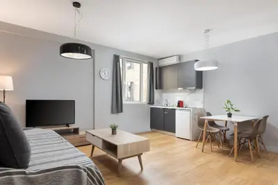 a living room with a couch and a table at Superior Suite by Acropolis Cozy Suites in Athens
