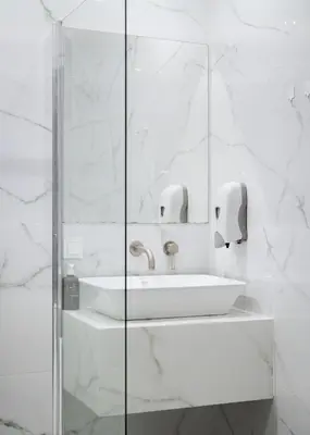 a white bathroom with a sink and a mirror at Superior Suite by Acropolis Cozy Suites in Athens