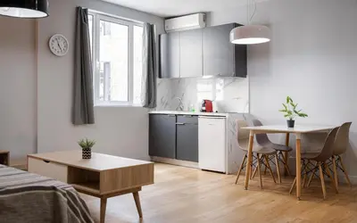 a small kitchen with a table and a dining room at Superior Suite by Acropolis Cozy Suites in Athens