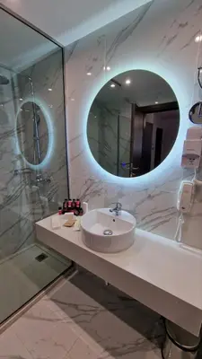 a bathroom with a sink and a mirror at International Atene hotel in Athens