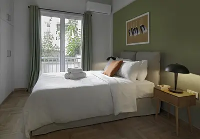 a bedroom with a large white bed and a window at New Hidden Gem, A Studio at a Super Prime Location in Athens