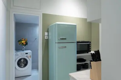 a refrigerator in a kitchen with a washing machine at New Hidden Gem, A Studio at a Super Prime Location in Athens