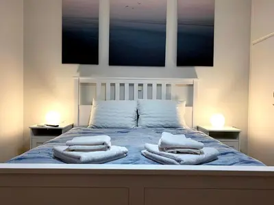 a bedroom with a bed with towels on it at Traveller's Choice in Athens