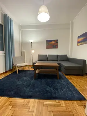a living room with a couch and a table at Traveller's Choice in Athens