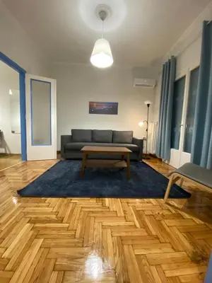 a living room with a couch and a coffee table at Traveller's Choice in Athens