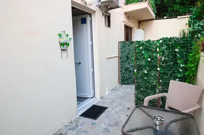 a patio with a sink in front of a door at Lysandros Apartments in Athens, near the METRO in Athens