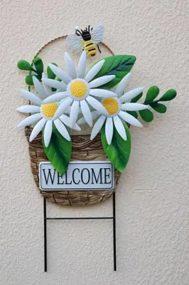 a welcome sign with white flowers in a basket at Lysandros Apartments in Athens, near the METRO in Athens