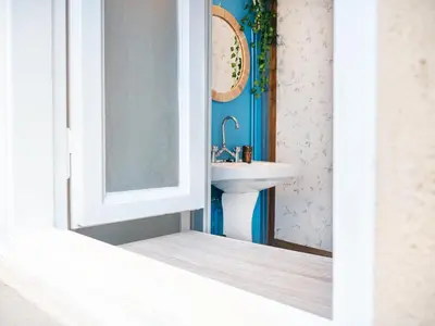 a bathroom with a sink and a mirror at The Arcade in Athens