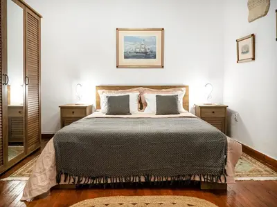 a bedroom with a large bed with two night stands at The Arcade in Athens