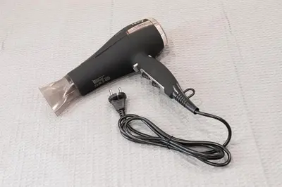 a close up of a hair dryer with a cord at Athenian center apartments in Athens