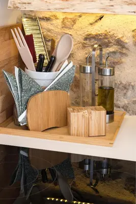 a wooden shelf with cooking utensils on it at Athena Luxury Studios in Athens