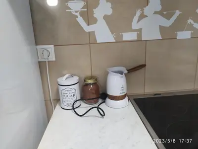 a kitchen counter with a coffee maker and a blender at Acropolis Urban Flat in Athens