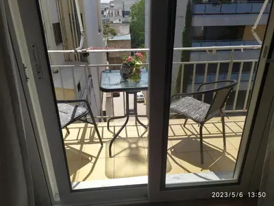 a view of a balcony with a table and chairs at Acropolis Urban Flat in Athens