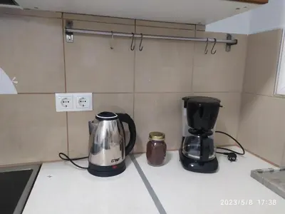 two coffee makers sitting on a counter in a kitchen at Acropolis Urban Flat in Athens