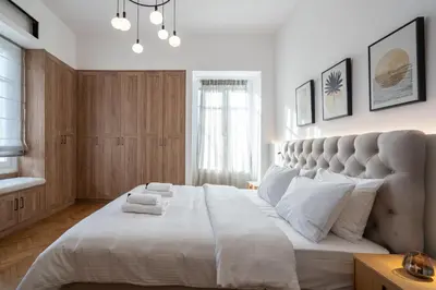 a bedroom with a large white bed with white pillows at Upscale Athens Luxury Penthouse in Athens