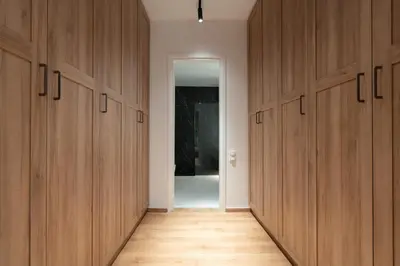 a hallway with wooden cabinets in a room at Upscale Athens Luxury Penthouse in Athens