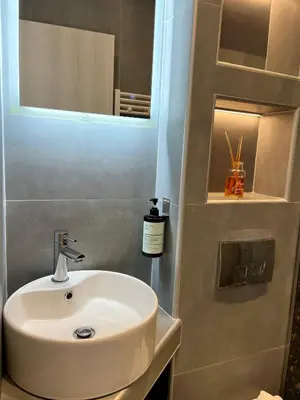 a bathroom with a sink and a mirror at VJ Athens in Athens