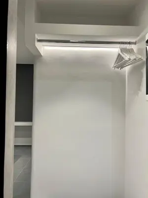 a bathroom with a light on the ceiling at VJ Athens in Athens